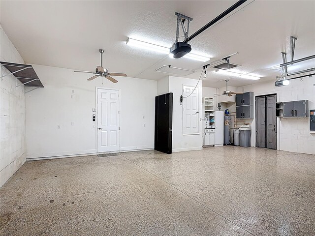 garage featuring a garage door opener, ceiling fan, and concrete block wall