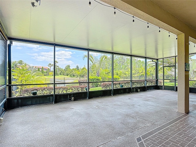unfurnished sunroom with plenty of natural light