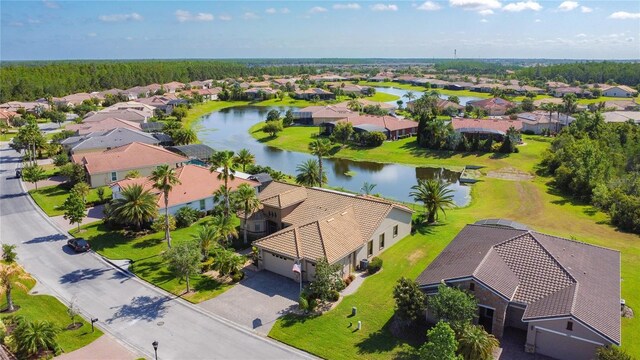 bird's eye view with a water view and a residential view