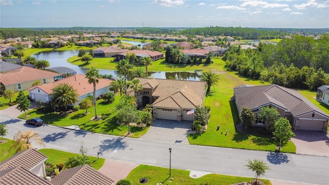 bird's eye view with a residential view and a water view