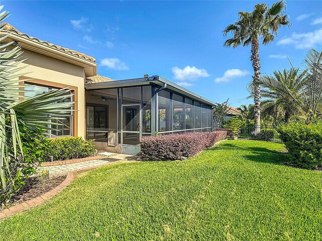 view of yard featuring a sunroom