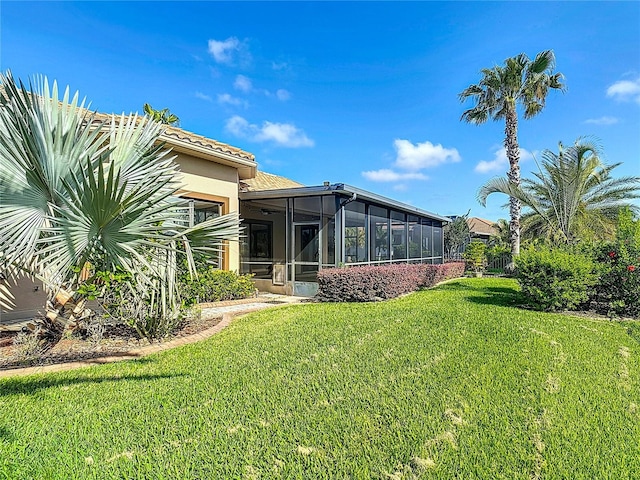view of yard with a sunroom