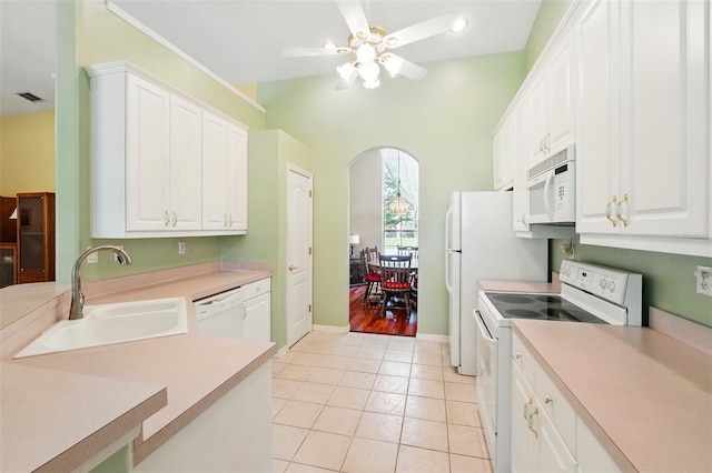 2374 Eagle Trace Dr, Kissimmee, FL 34746 - kitchen featuring light tile patterned floors, a sink, ceiling fan, visible vents, and white appliances