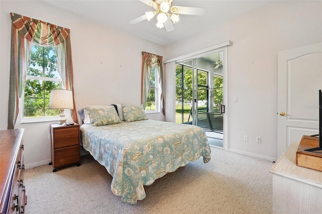 2374 Eagle Trace Dr, Kissimmee, FL 34746 - bedroom featuring baseboards, access to exterior, and light carpet