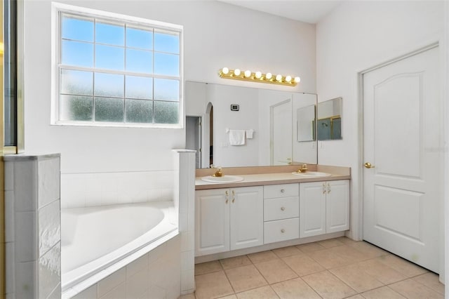 2374 Eagle Trace Dr, Kissimmee, FL 34746 - full bathroom featuring tile patterned floors, double vanity, a bath, and a sink
