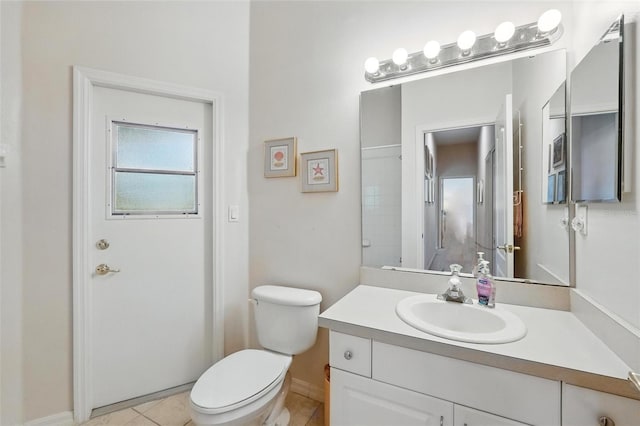 2374 Eagle Trace Dr, Kissimmee, FL 34746 - bathroom with toilet, tile patterned flooring, vanity, and baseboards