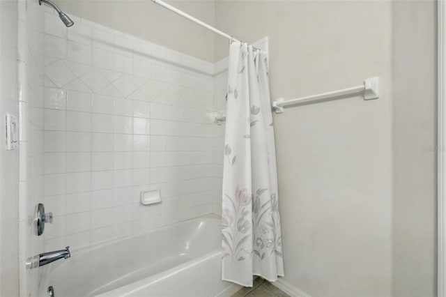 2374 Eagle Trace Dr, Kissimmee, FL 34746 - bathroom with tile patterned flooring, shower / tub combo with curtain, and baseboards