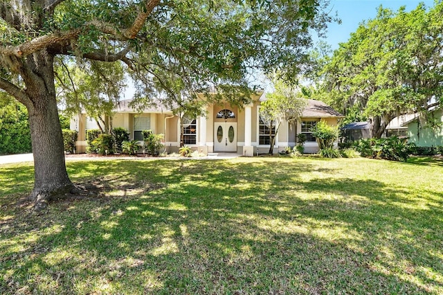 2374 Eagle Trace Dr, Kissimmee, FL 34746 - view of front of property featuring a front yard and stucco siding
