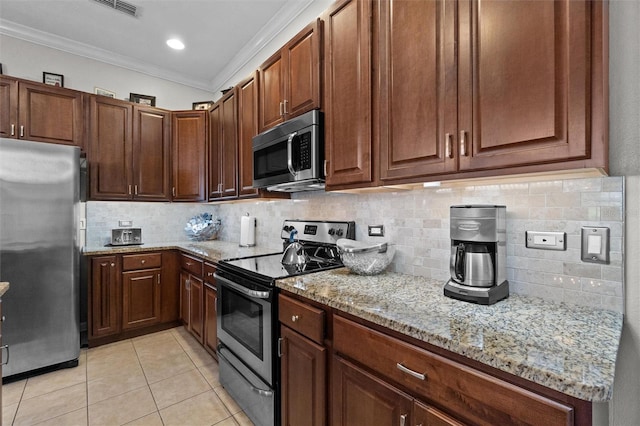 kitchen featuring tasteful backsplash, light stone countertops, appliances with stainless steel finishes, ornamental molding, and light tile patterned flooring