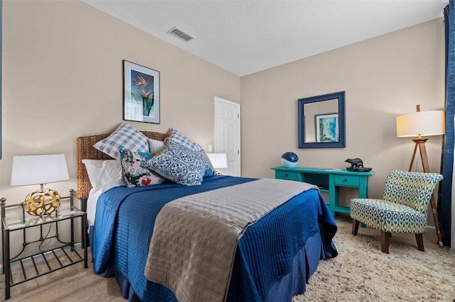 bedroom with visible vents and carpet floors