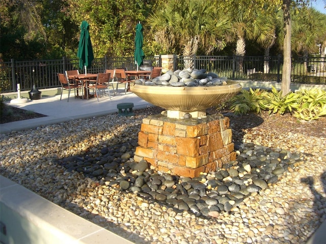 view of patio featuring fence