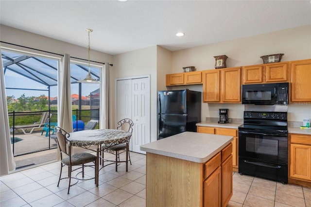 301 Rosso Dr, Davenport, FL 33837 - kitchen with light tile patterned floors, a kitchen island, light countertops, black appliances, and pendant lighting