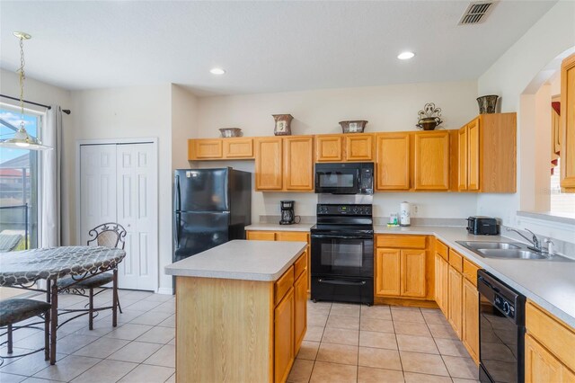 301 Rosso Dr, Davenport, FL 33837 - kitchen with visible vents, black appliances, plenty of natural light, and a sink