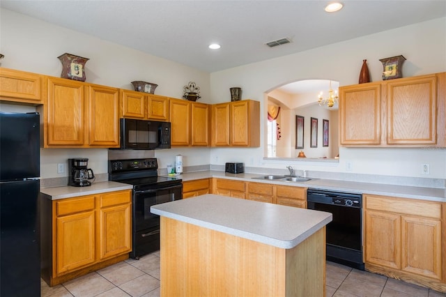 301 Rosso Dr, Davenport, FL 33837 - kitchen featuring a sink, black appliances, visible vents, and light countertops