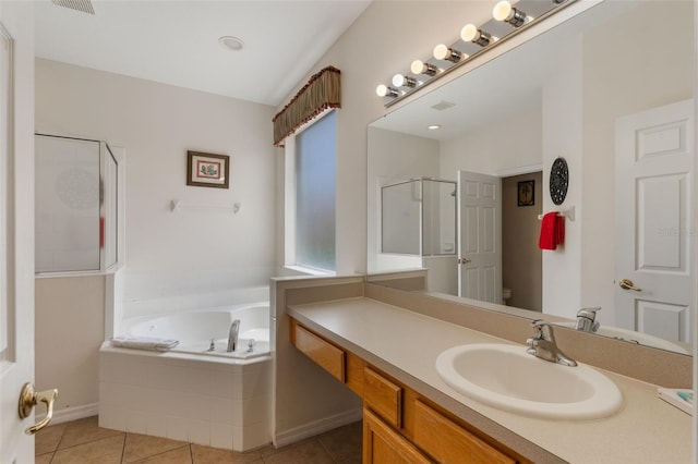 301 Rosso Dr, Davenport, FL 33837 - full bathroom with vanity, a bath, toilet, a stall shower, and tile patterned flooring