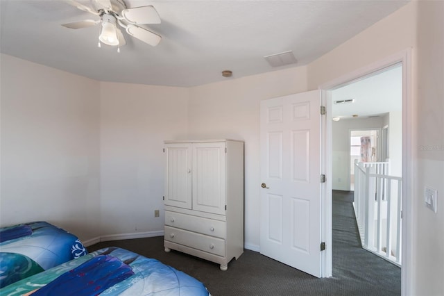 301 Rosso Dr, Davenport, FL 33837 - bedroom featuring dark carpet, visible vents, a ceiling fan, and baseboards
