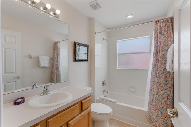 301 Rosso Dr, Davenport, FL 33837 - full bathroom featuring shower / tub combo, vanity, toilet, and visible vents