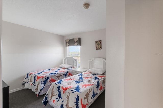 301 Rosso Dr, Davenport, FL 33837 - carpeted bedroom featuring baseboards