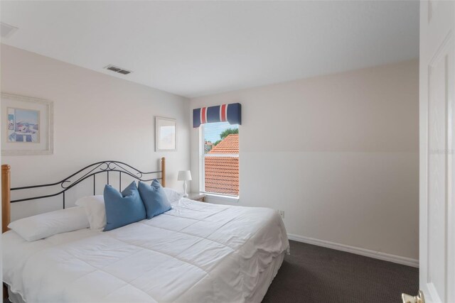 301 Rosso Dr, Davenport, FL 33837 - bedroom featuring baseboards, visible vents, and carpet flooring