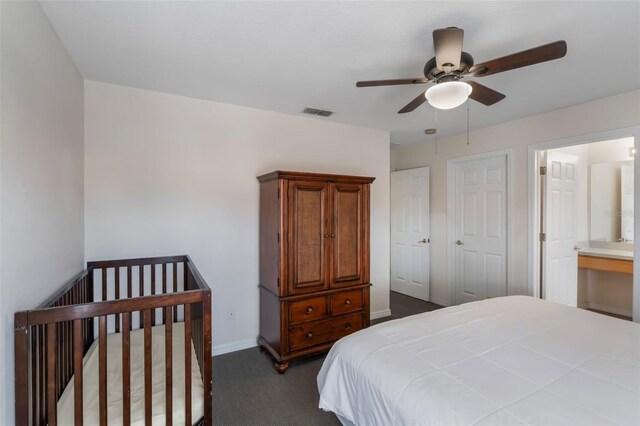 301 Rosso Dr, Davenport, FL 33837 - bedroom with visible vents, dark colored carpet, ceiling fan, and baseboards