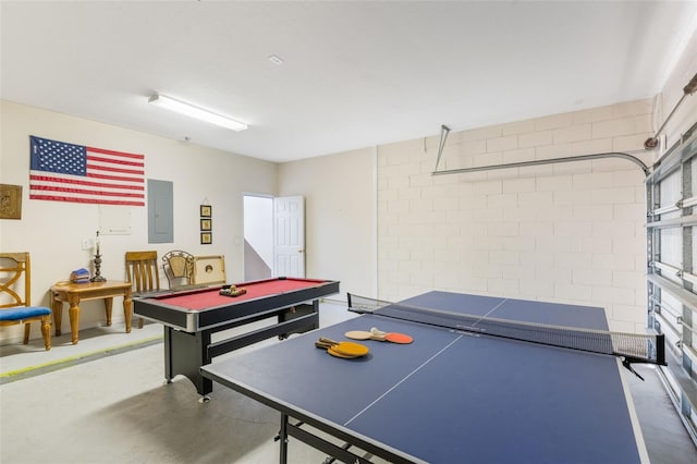 301 Rosso Dr, Davenport, FL 33837 - rec room with concrete floors, billiards, concrete block wall, and electric panel