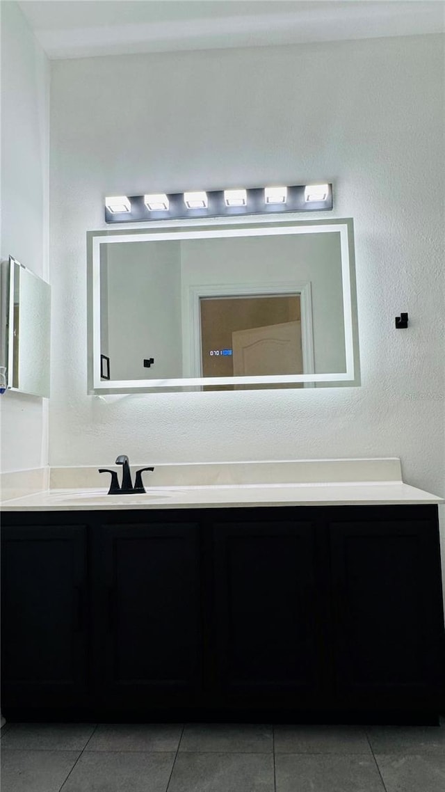 bathroom with vanity and tile patterned flooring
