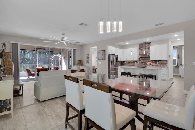 2487 Empress Dr, Kissimmee, FL 34741 - dining area with visible vents, a ceiling fan, and recessed lighting