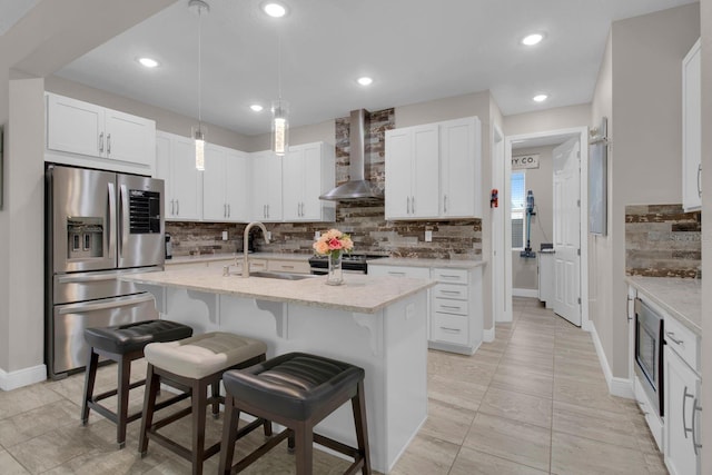 2487 Empress Dr, Kissimmee, FL 34741 - kitchen with decorative backsplash, baseboards, wall chimney exhaust hood, a sink, and appliances with stainless steel finishes