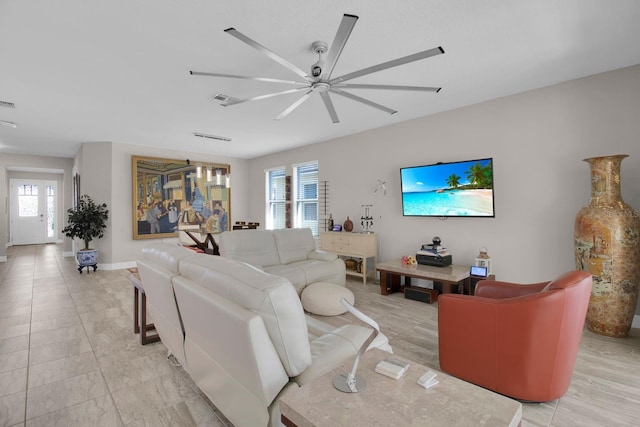 2487 Empress Dr, Kissimmee, FL 34741 - living area featuring a ceiling fan, baseboards, and visible vents