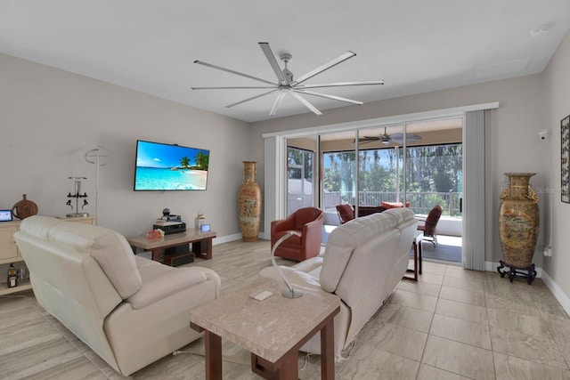 2487 Empress Dr, Kissimmee, FL 34741 - living area featuring ceiling fan and baseboards