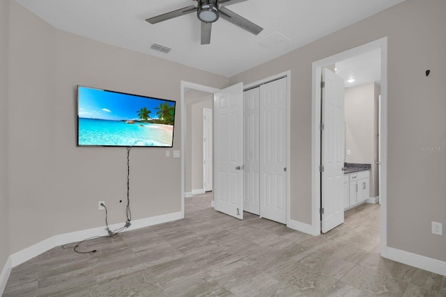 2487 Empress Dr, Kissimmee, FL 34741 - unfurnished bedroom with connected bathroom, baseboards, visible vents, and a closet