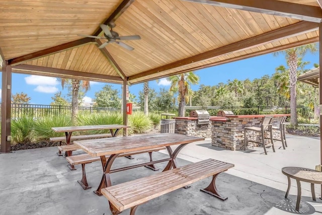 2487 Empress Dr, Kissimmee, FL 34741 - view of patio featuring a fenced backyard, ceiling fan, area for grilling, and a bar