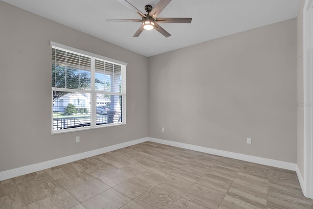 2487 Empress Dr, Kissimmee, FL 34741 - spare room with baseboards and ceiling fan