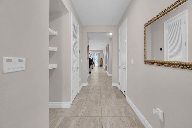2487 Empress Dr, Kissimmee, FL 34741 - hallway featuring baseboards