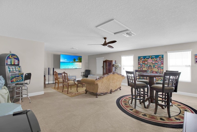 2487 Empress Dr, Kissimmee, FL 34741 - living room featuring visible vents, light carpet, baseboards, attic access, and a textured ceiling
