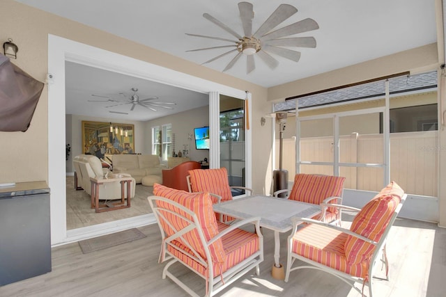 2487 Empress Dr, Kissimmee, FL 34741 - sunroom with a ceiling fan, outdoor dining area, and an outdoor hangout area