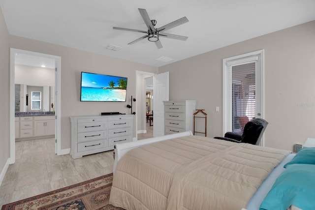 2487 Empress Dr, Kissimmee, FL 34741 - bedroom featuring connected bathroom, baseboards, visible vents, and ceiling fan