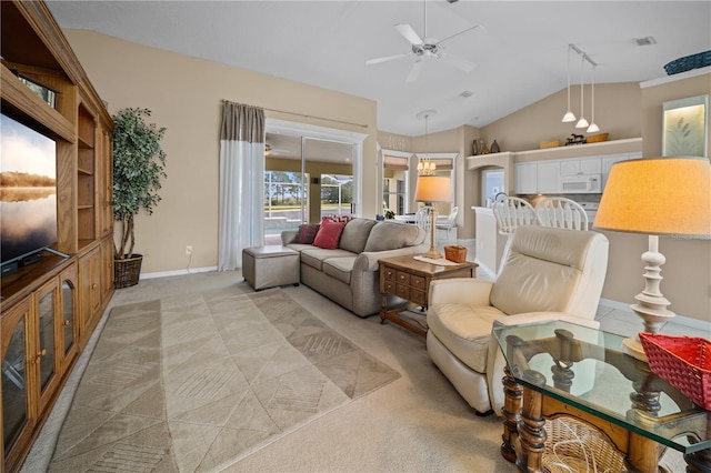 living room with ceiling fan, visible vents, vaulted ceiling, light carpet, and baseboards