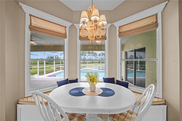 dining space featuring a notable chandelier