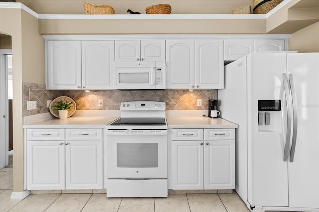 kitchen featuring white cabinets, white appliances, light countertops, and decorative backsplash