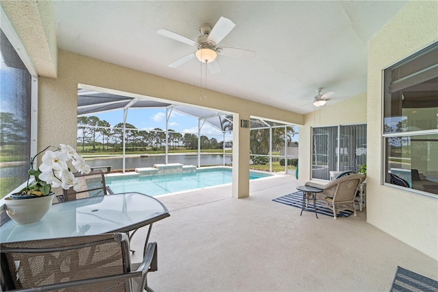 sunroom with a pool, a ceiling fan, and a healthy amount of sunlight