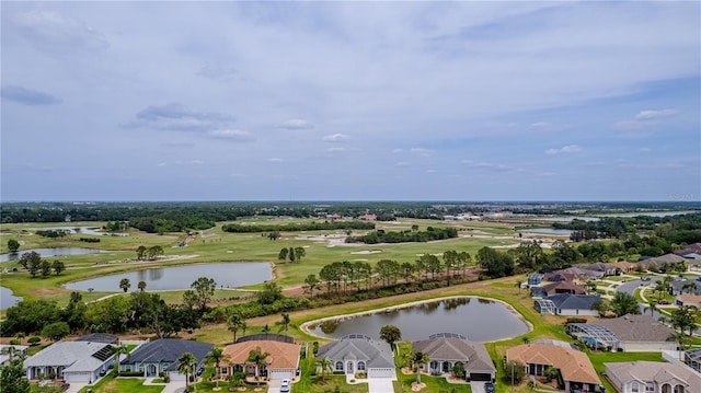 aerial view featuring golf course view, a water view, and a residential view