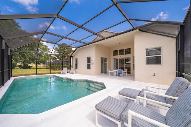pool featuring a lanai and a patio area