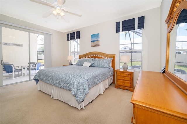 bedroom featuring access to outside, a ceiling fan, and light colored carpet