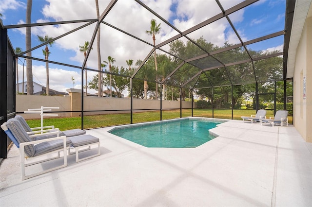 outdoor pool featuring a yard, a lanai, and a patio area