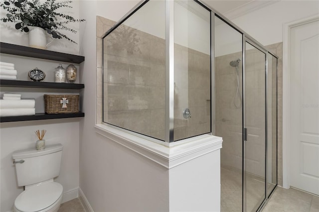 full bathroom with a stall shower, toilet, and tile patterned flooring