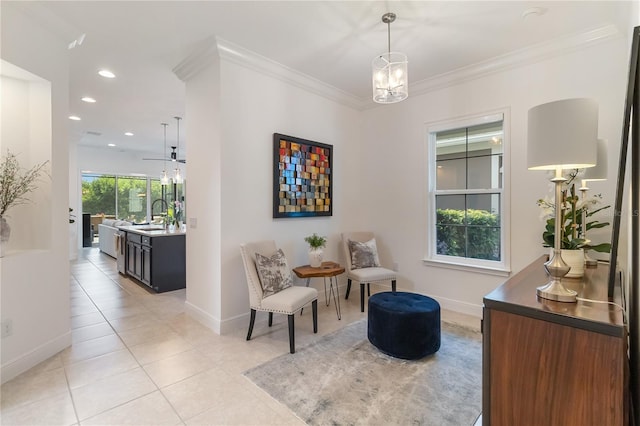 sitting room with light tile patterned flooring, recessed lighting, ornamental molding, and baseboards