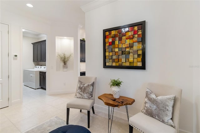 living area featuring recessed lighting, light tile patterned floors, ornamental molding, washing machine and dryer, and baseboards