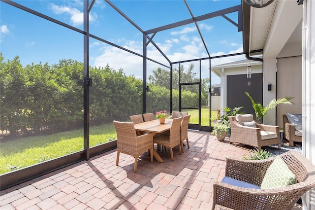 sunroom / solarium with outdoor dining area