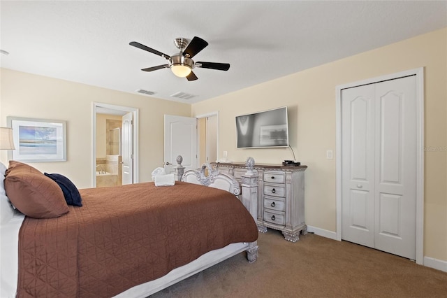carpeted bedroom featuring a ceiling fan, visible vents, baseboards, and ensuite bath